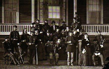 Back Row: Mrs. T. McDougall, Capt. Thomas McDougall, Lt. William Badger, Charles W. Thompson, Col. J. S. Poland, Lt. Thomas W. Custer, Capt. William Thompson 